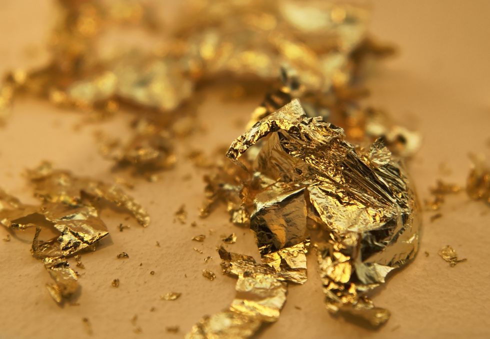 gilding-theme-with-disrupted-gold-leaves-royalty-free-image-1647439483.jpg